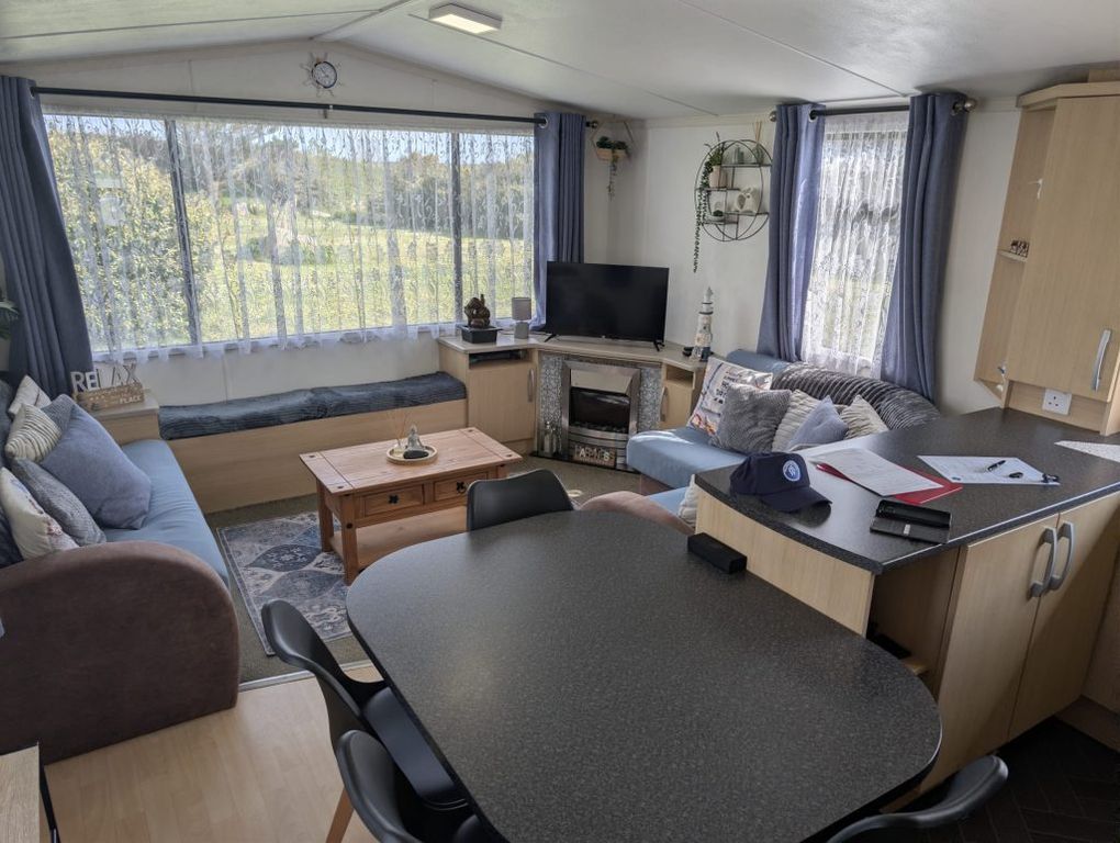 Property photo 3 of 12 Bright Open Plan Lounge And Dining Area With Fixed Seating And Fireplace