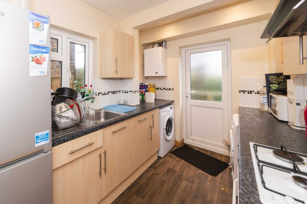 Property photo 3 of 9 Bright Modern Kitchen With Light Wood Cabinets, Da...