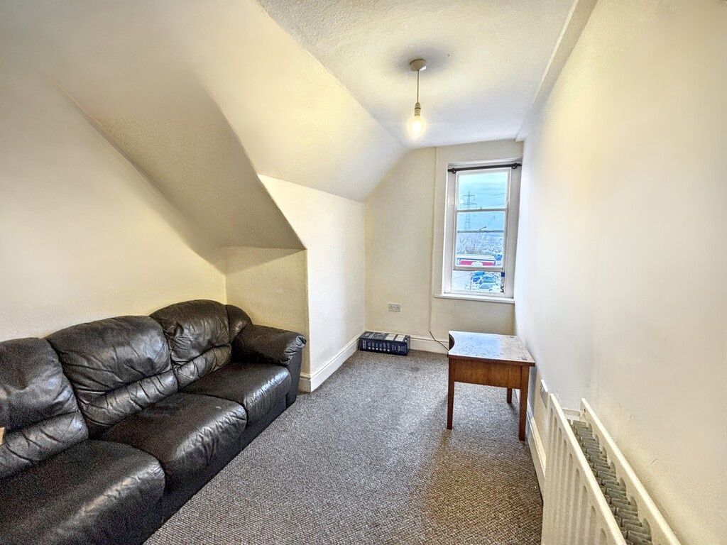 Property photo 2 of 4 Bright Narrow Living Room With A Three-Seat Leathe...