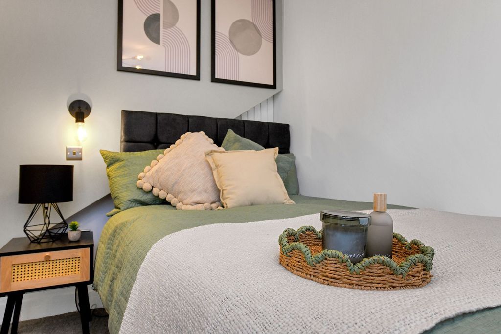 Property photo 2 of 7 A Beautifully Decorated Master Bedroom Featuring A...