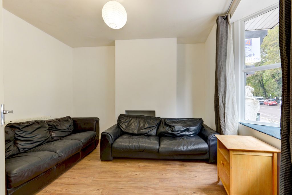 Property photo 2 of 20 A Well-Lit, Tidy Living Room Featuring Two Large B...