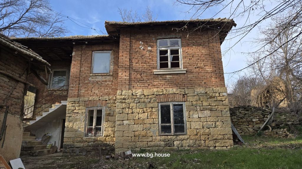 Property photo 1 of 53 Exterior View Of A Two-Storey House Showing Stone And Brick Walls With Several Windows And An Outdoor Staircase