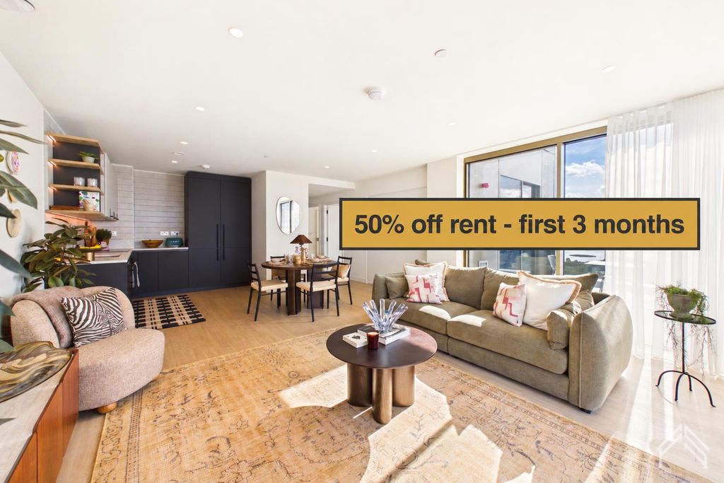 Property photo 1 of 16 Gold Rent Banner Above Olive Sofa.Png