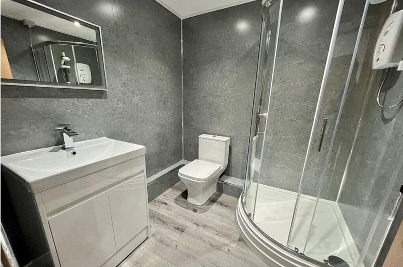 Property photo 2 of 10 Modern Bathroom With A Corner Glass Shower Enclosu...
