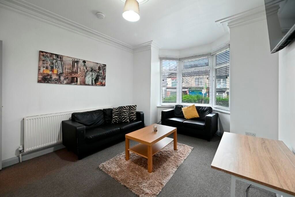 Property photo 1 of 15 Bright And Cozy Living Room Featuring Comfortable ...