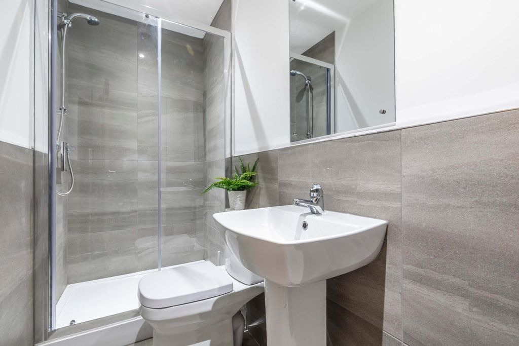 Property photo 3 of 11 Modern Bathroom Suite With A Glass-Enclosed Shower...