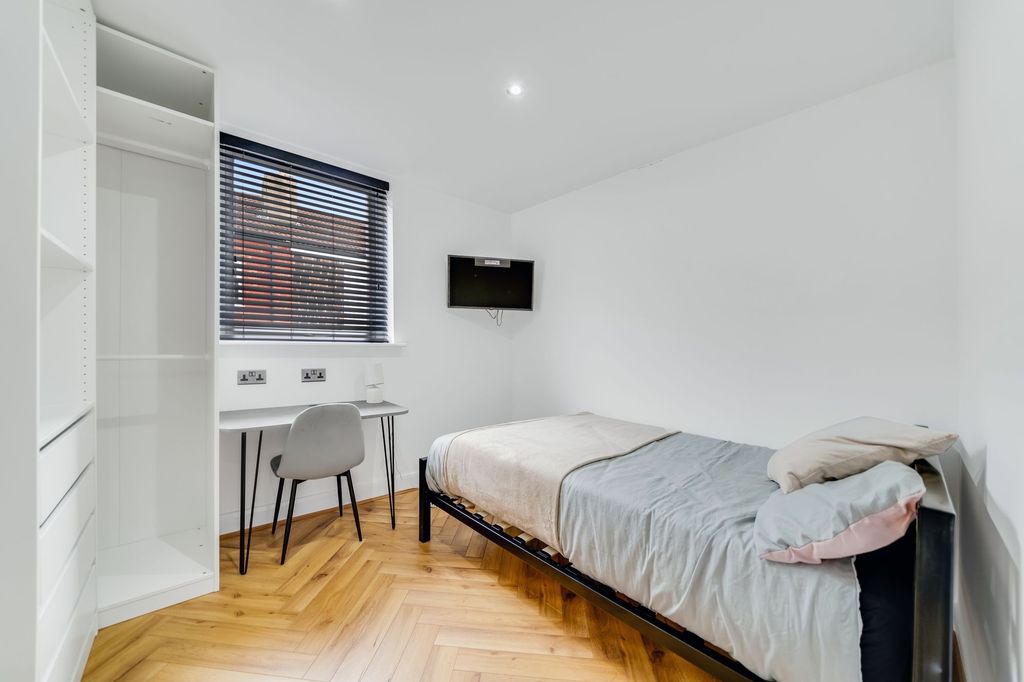 Property photo 3 of 4 Bright And Clean Bedroom Featuring A Single Bed, A...