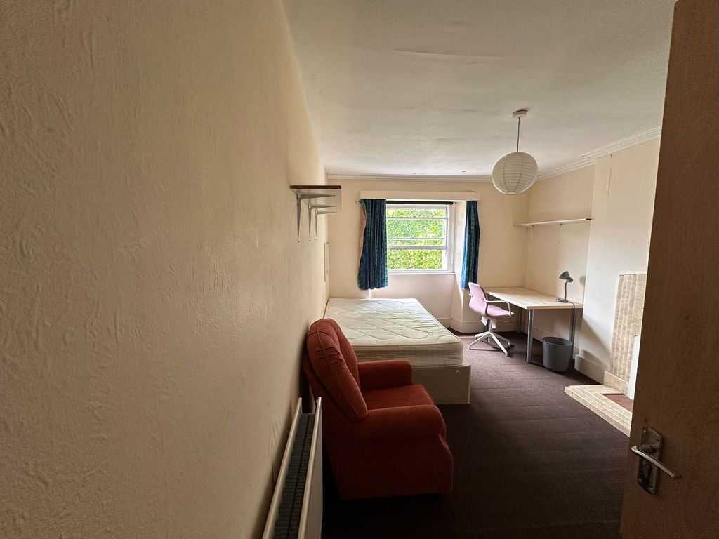 Property photo 1 of 18 A Simple And Functional Bedroom Featuring A Single...