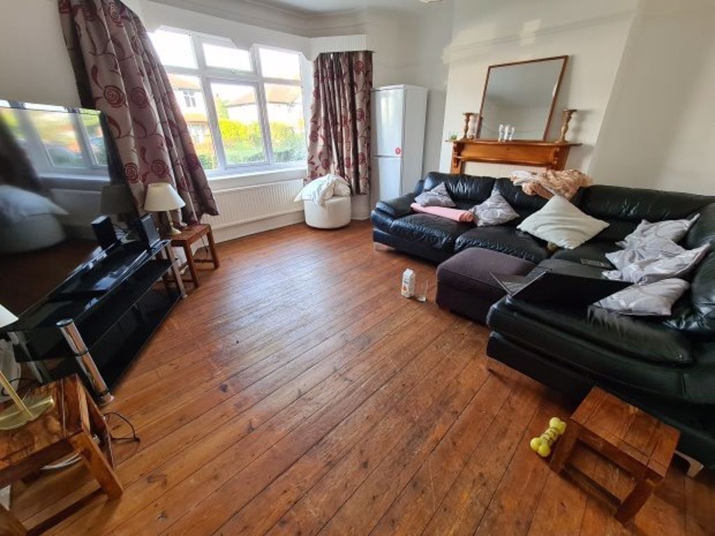 Property photo 1 of 10 A Bright, Spacious Living Room Featuring Large Win...