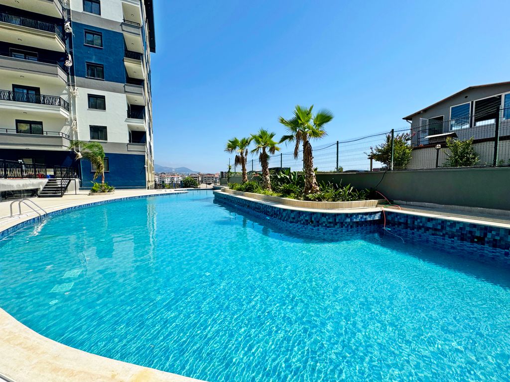 Property photo 1 of 24 Modern Alanya One-Bedroom Property For Sale – A Large Communal Swimming Pool