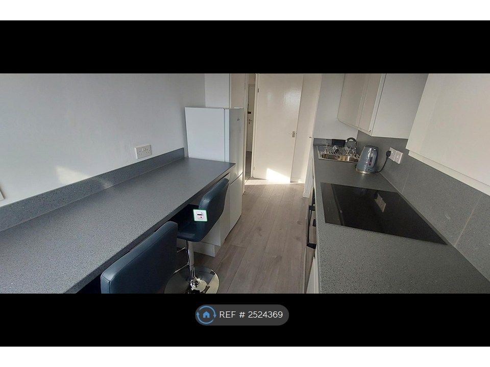 Property photo 2 of 11 Kitchen With Breakfast Bar And Stools