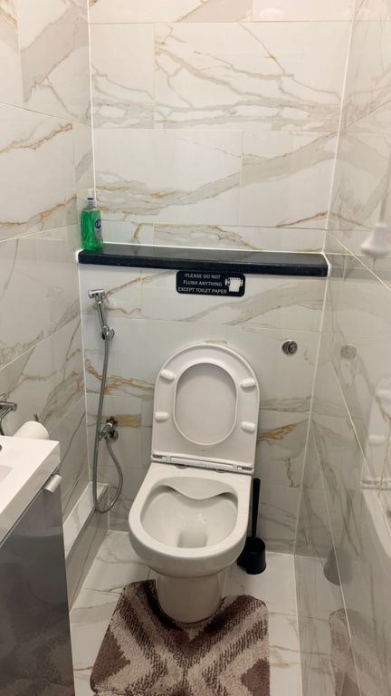 Property photo 2 of 3 Elegant Marble-Effect Tiling In A Modern WC...