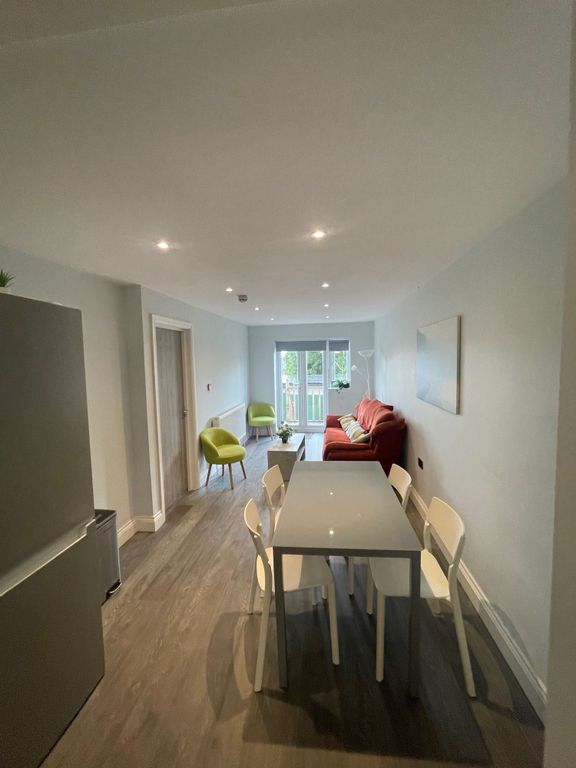 Property photo 2 of 12 A Modern Living And Dining Area Featuring A Comfor...