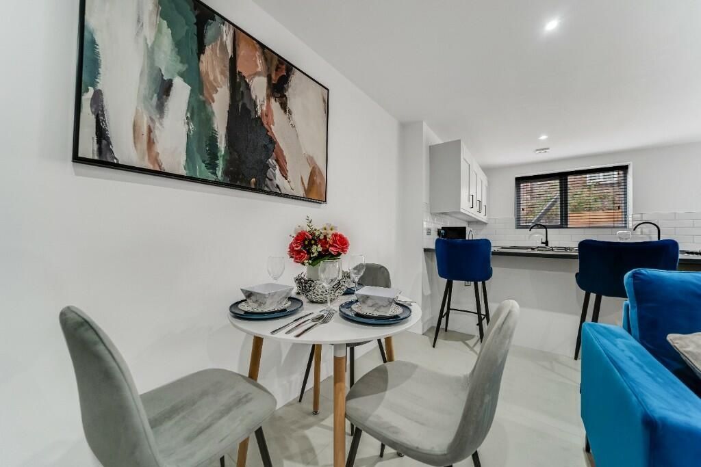 Property photo 2 of 12 A Bright And Modern Living Room Featuring Contempo...