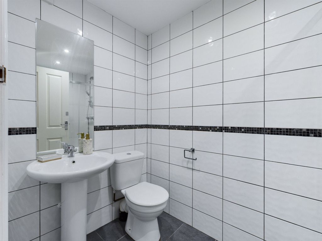 Property photo 2 of 34 A Bright And Modern Bathroom Featuring Sleek Tiles...
