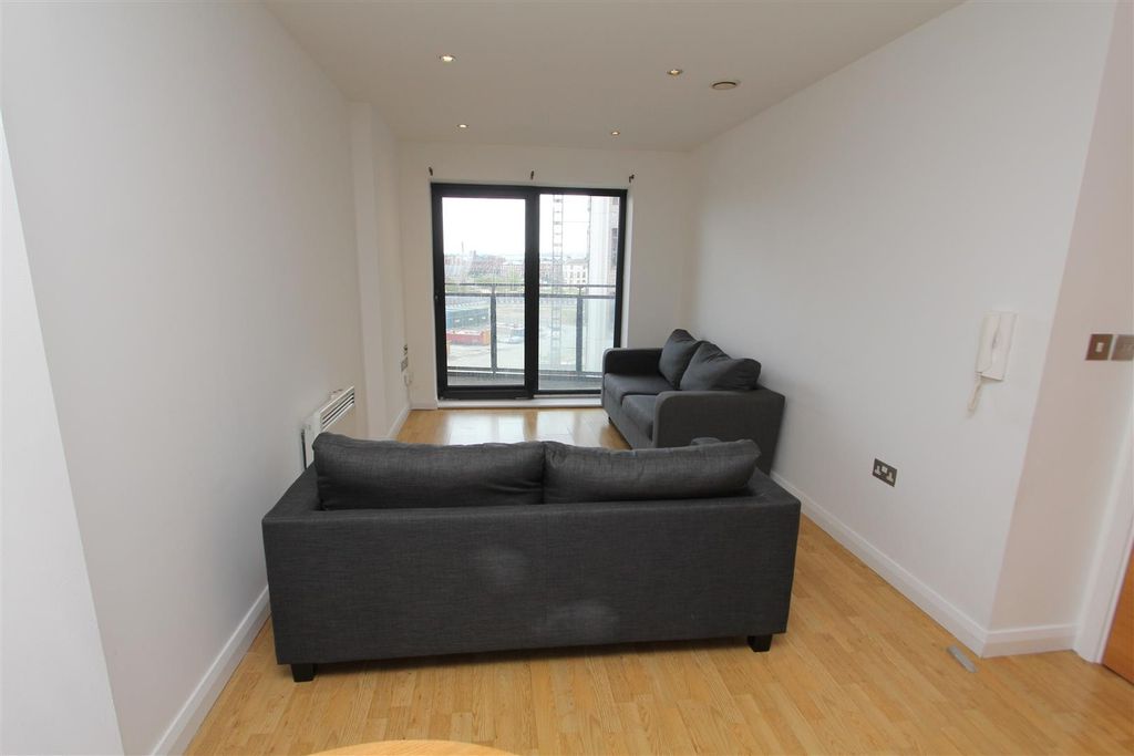 Property photo 3 of 9 Modern Living Space With Balcony And Sleek Sofas...