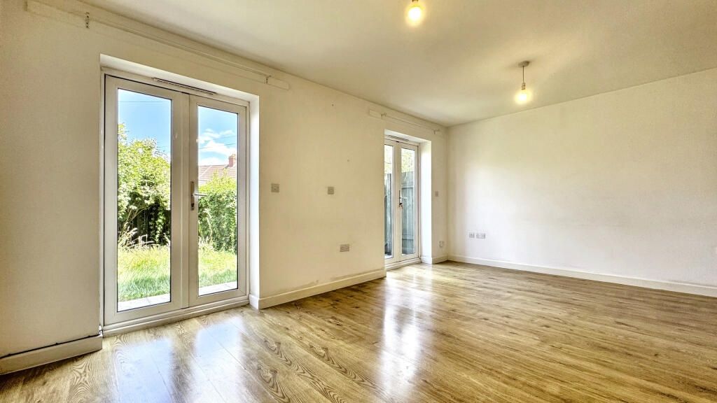 Property photo 1 of 14 Bright And Airy Living Room Featuring Large Glass ...