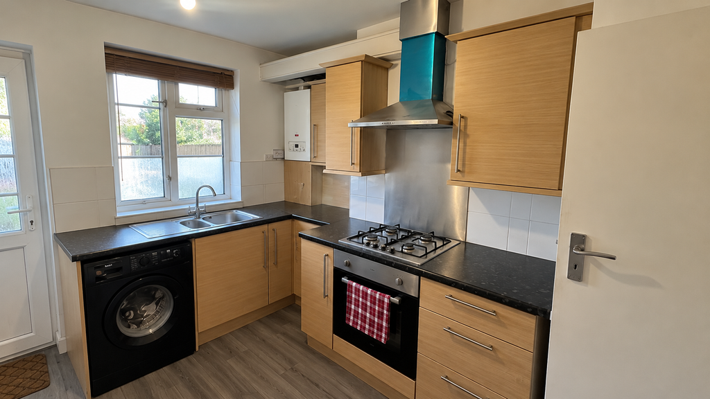 Property photo 3 of 9 Tidy Light-Oak Kitchen Interior