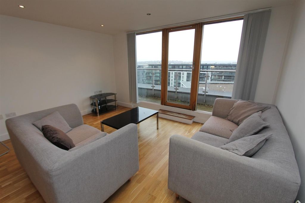 Property photo 2 of 9 Bright Lounge With Balcony And Plush Sofas....