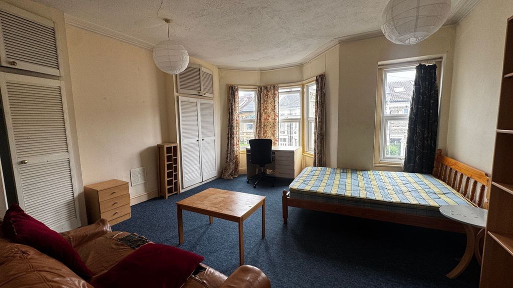 Property photo 1 of 15 Bright And Welcoming Bedroom Featuring A Wooden Be...