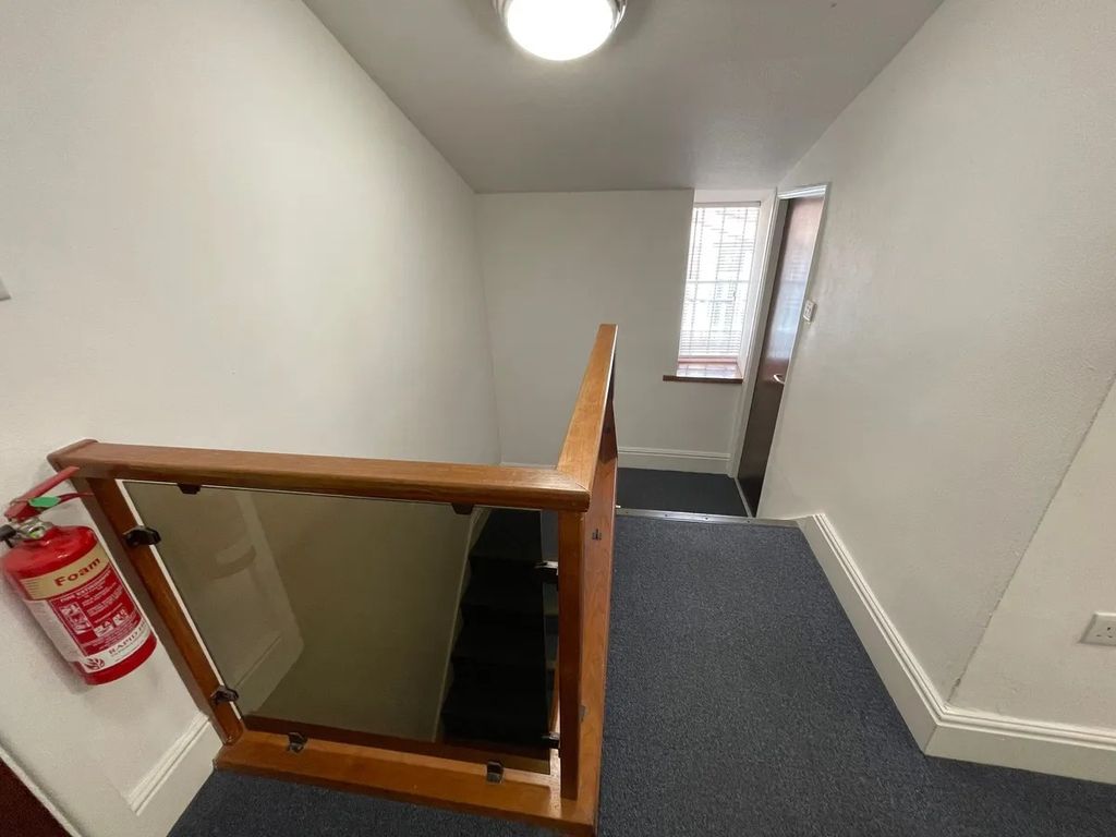 Property photo 1 of 13 Well-Maintained Staircase Area Featuring A Secure ...