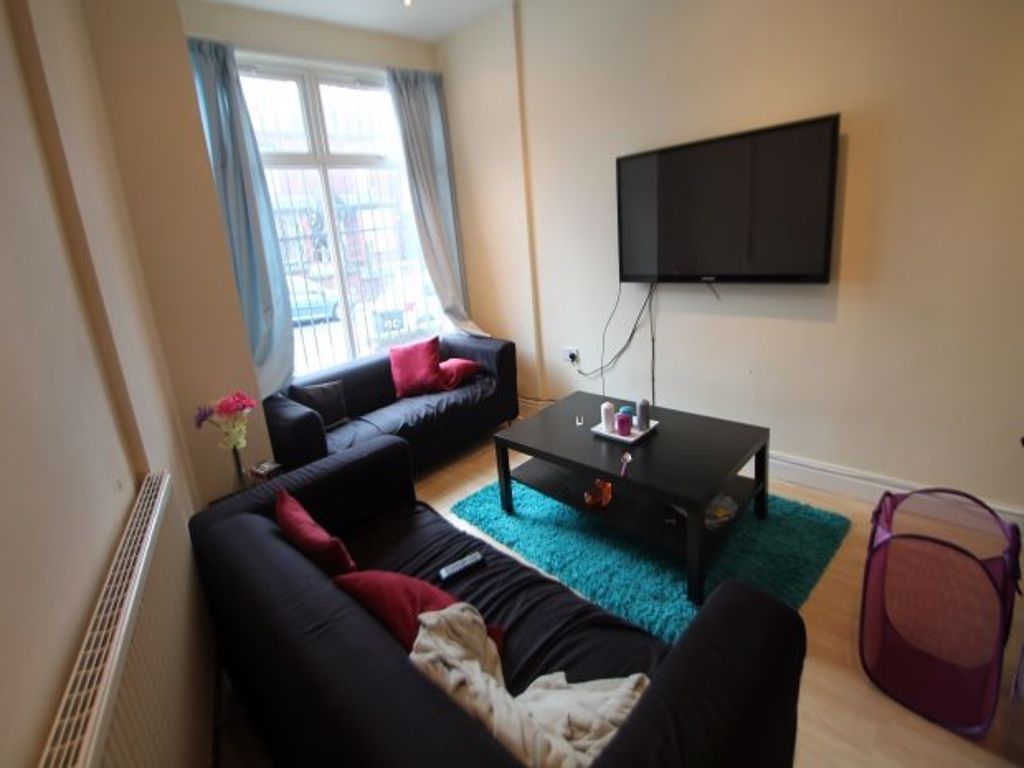 Property photo 1 of 18 A Modern, Well-Lit Living Room Featuring Comfortab...