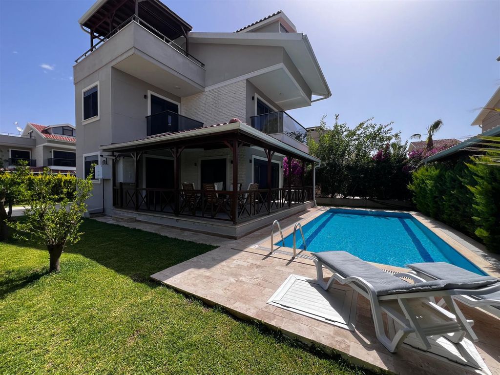 Property photo 1 of 24 Appealing Villa For Sale In Antalya - Main View Of The Villa, Pool, And Private Garden