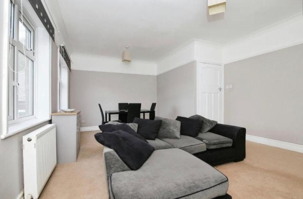 Property photo 2 of 10 This Inviting Living Room Features Ample Space For...