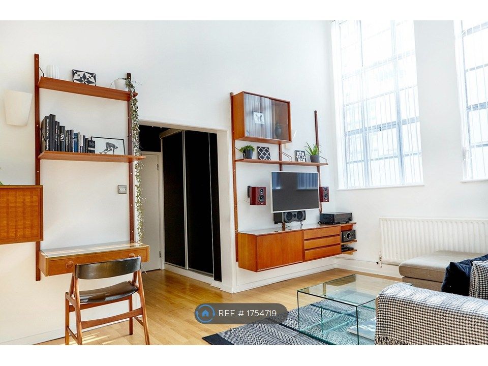 Property photo 3 of 17 Double-Height Living Space