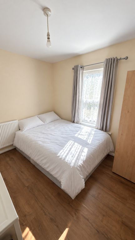 Property photo 2 of 9 Plaistow-Bedroom-View3-White-Bedding-Grey-Curtains