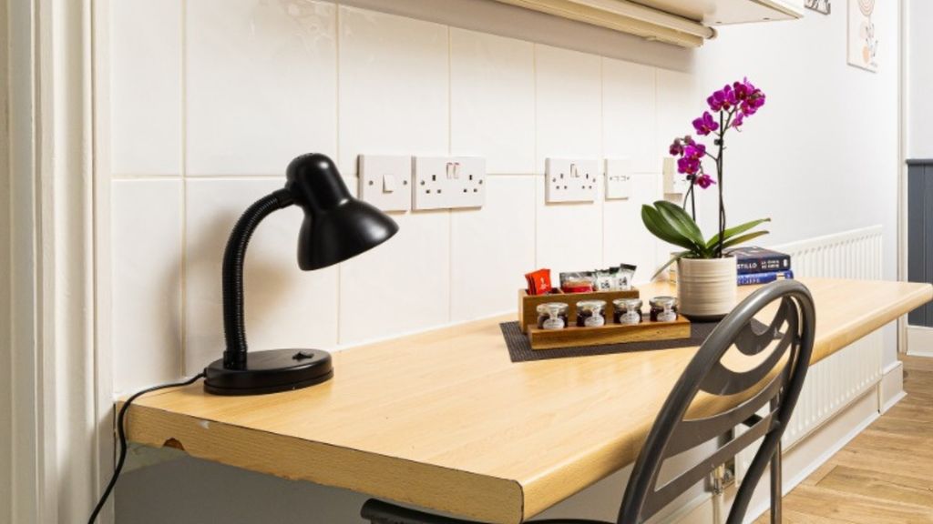 Property photo 3 of 6 A Bright And Tidy Kitchenette Featuring Modern Dec...