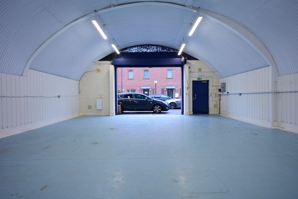 Property photo 3 of 5 An Empty Arch With White Lining, Facing The Front Electric Roller Shutter Entrance, Which Is Open.