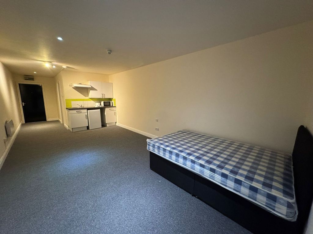 Property photo 2 of 2 Bright And Spacious Living Area Featuring A Comfor...