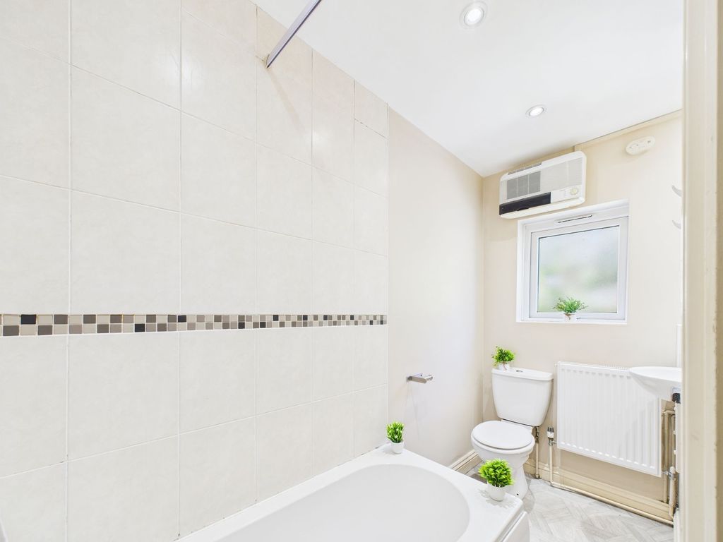 Property photo 1 of 6 Bright And Clean Bathroom Featuring A Bathtub With...