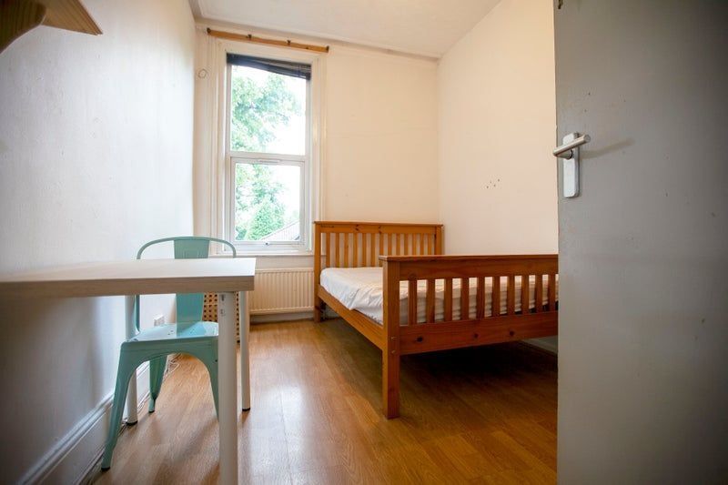 Property photo 3 of 8 Simple Bedroom With Bed And Desk By Window...