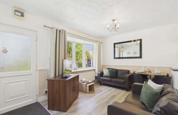 Property photo 2 of 9 Bright Open Plan Lounge With Sofas, Dining Area And Large Window