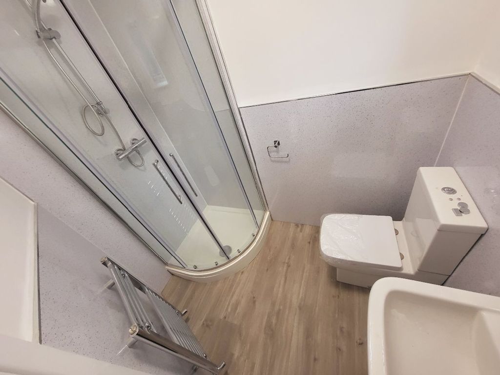 Property photo 1 of 15 This Modern Bathroom Features A Spacious Shower, S...
