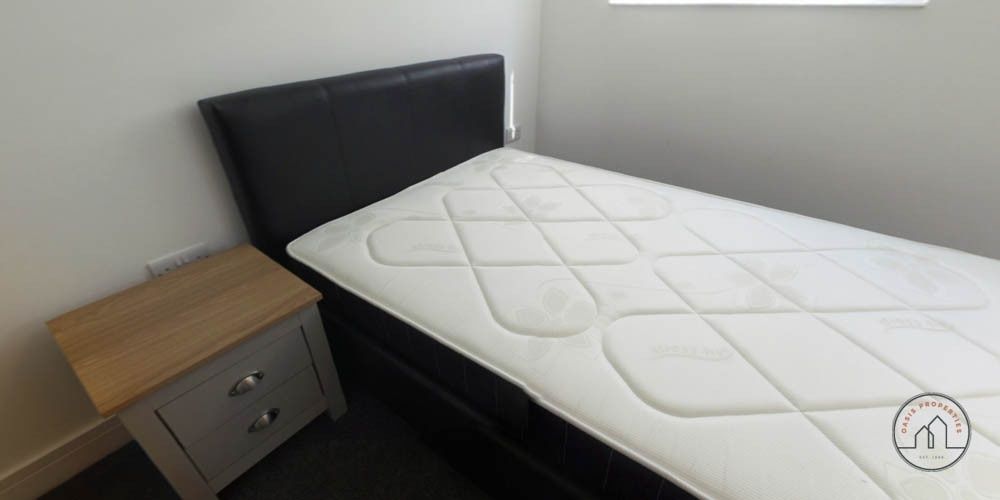 Property photo 2 of 8 A Tidy Bedroom With A Comfortable Bed, A Nightstan...