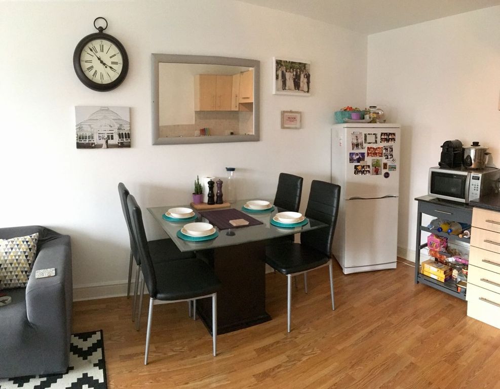 Property photo 2 of 7 A Modern Living And Dining Area Featuring A Stylis...