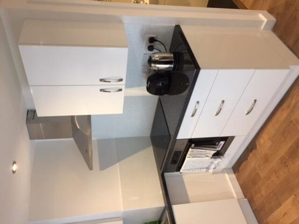 Property photo 2 of 8 A Modern And Tidy Kitchenette Featuring Stylish Ca...