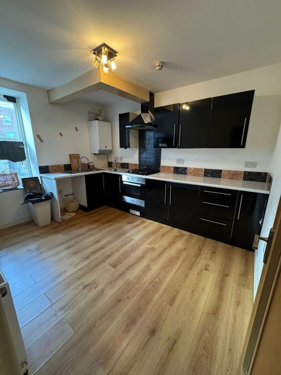 Property photo 1 of 4 Sleek Modern Kitchen With Ample Floor Space...