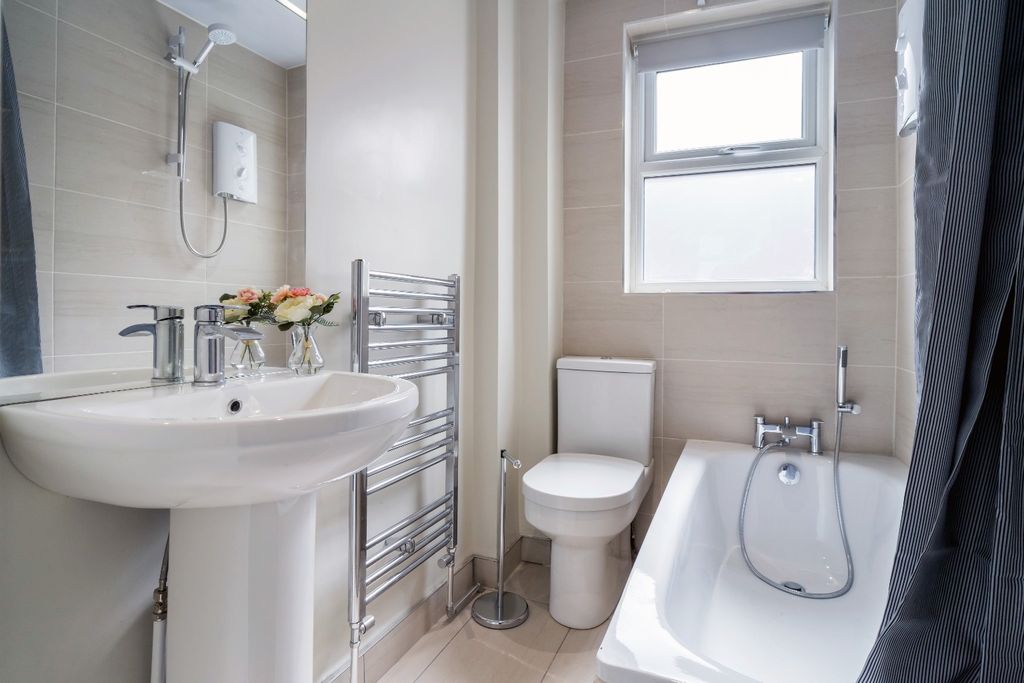 Property photo 2 of 15 This Modern Bathroom Features A Sleek Design With ...