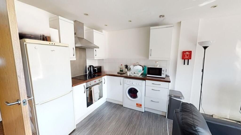 Property photo 3 of 5 A Modern And Tidy Kitchen Featuring White Cabinetr...