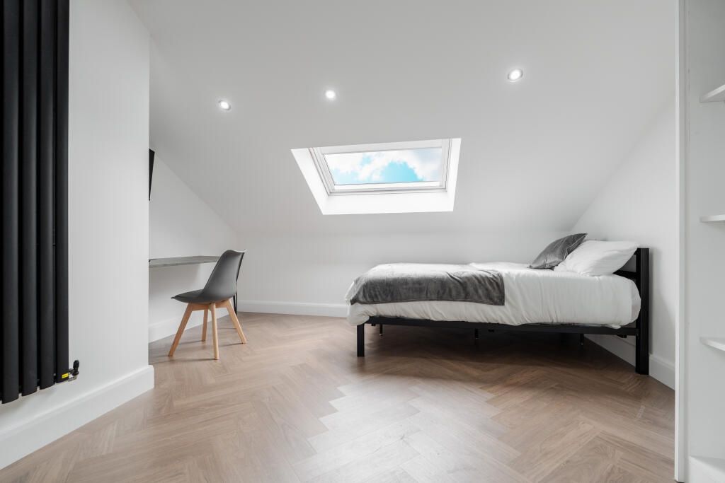 Property photo 2 of 15 A Spacious, Modern Master Bedroom Featuring A Comf...