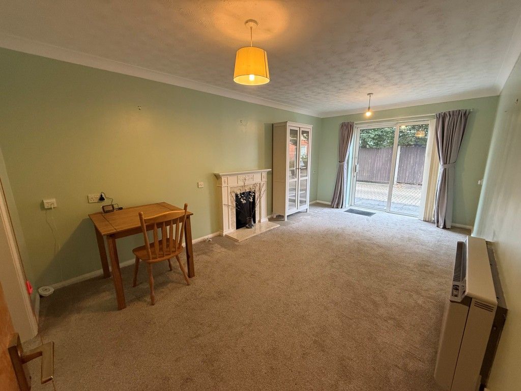 Property photo 2 of 8 Carpeted Lounge With French Doors To Courtyard