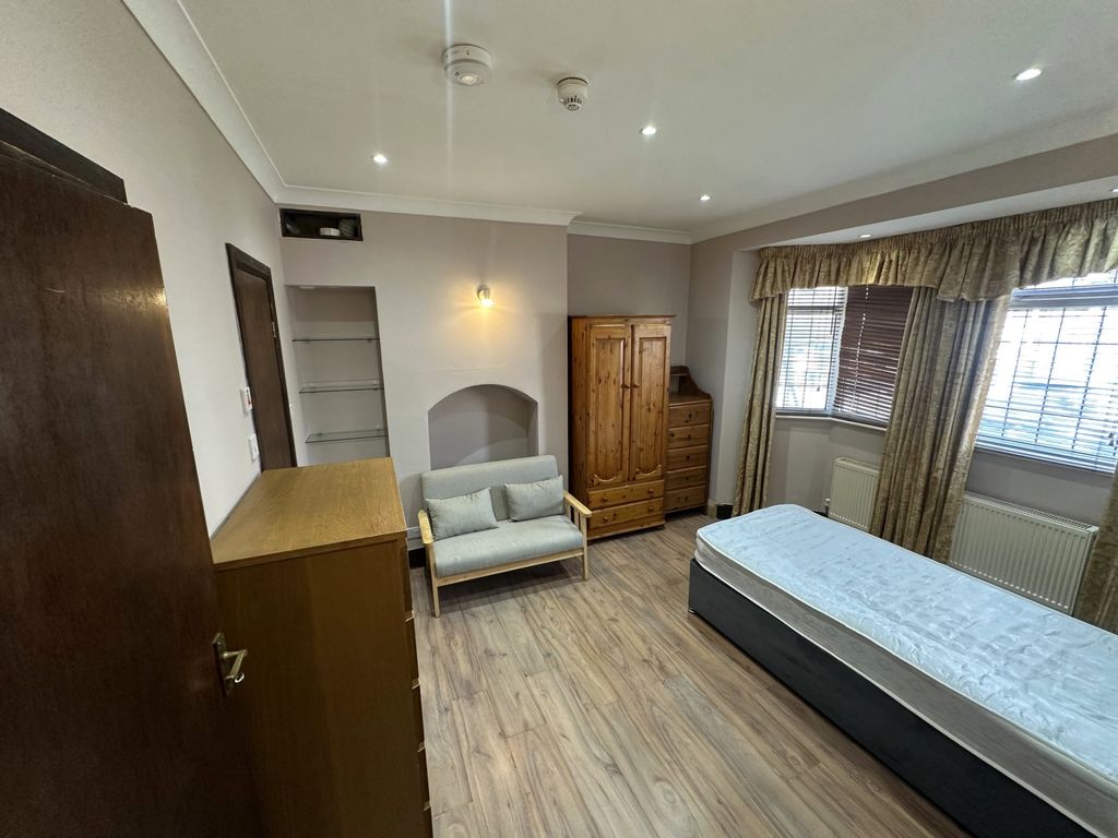 Property photo 2 of 8 Spacious Bedroom With Ample Storage And Seating...