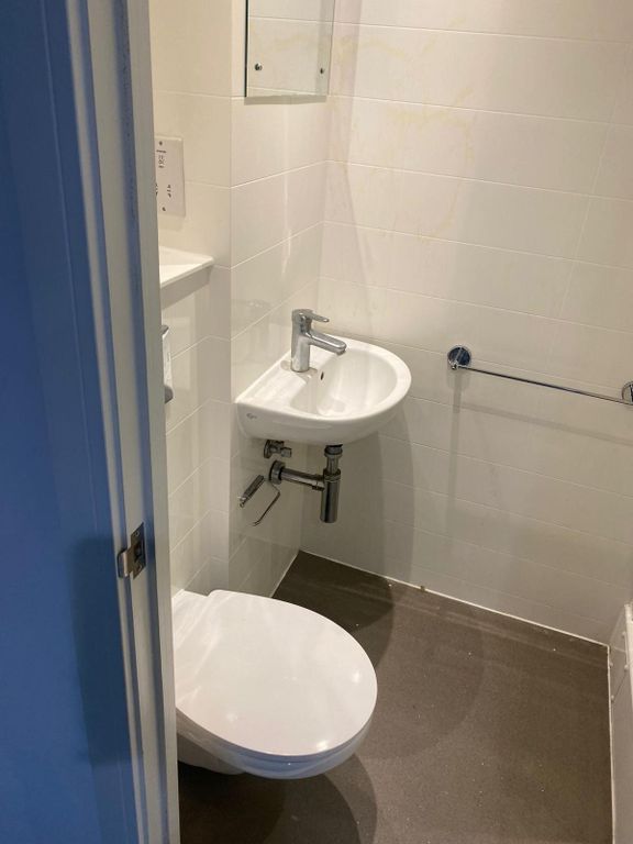 Property photo 2 of 7 This Modern Single Toilet Features A Sleek Design,...