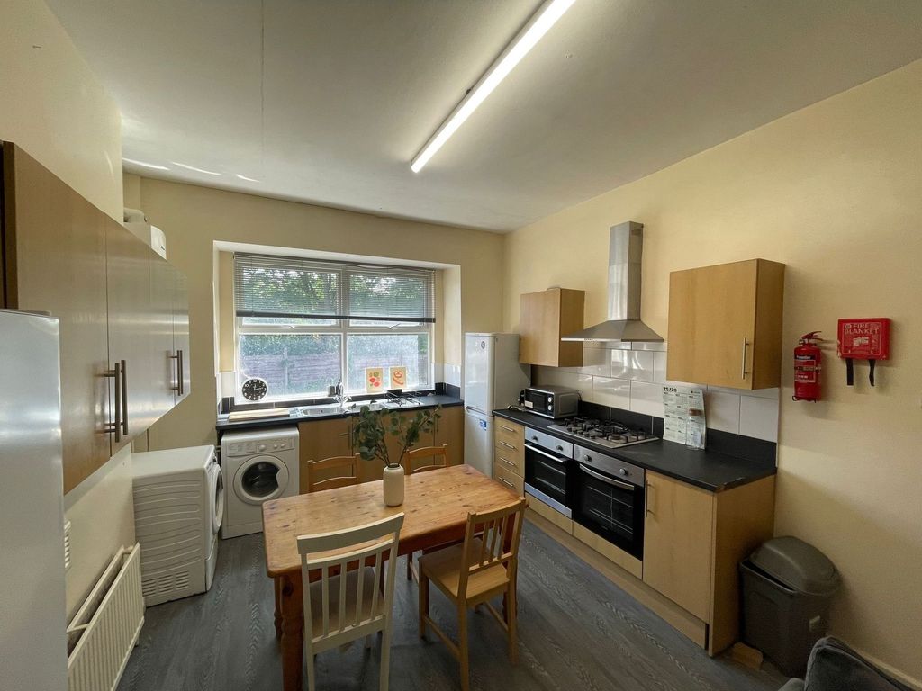 Property photo 2 of 19 Bright And Functional Kitchen Featuring A Large Wi...