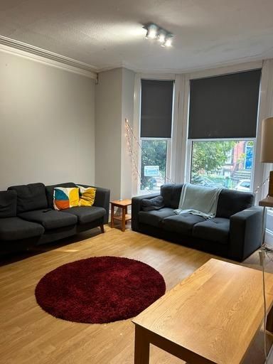 Property photo 3 of 13 A Bright And Welcoming Living Room Featuring Comfo...