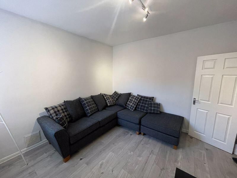 Property photo 3 of 12 A Spacious And Well-Maintained Living Room Featuri...